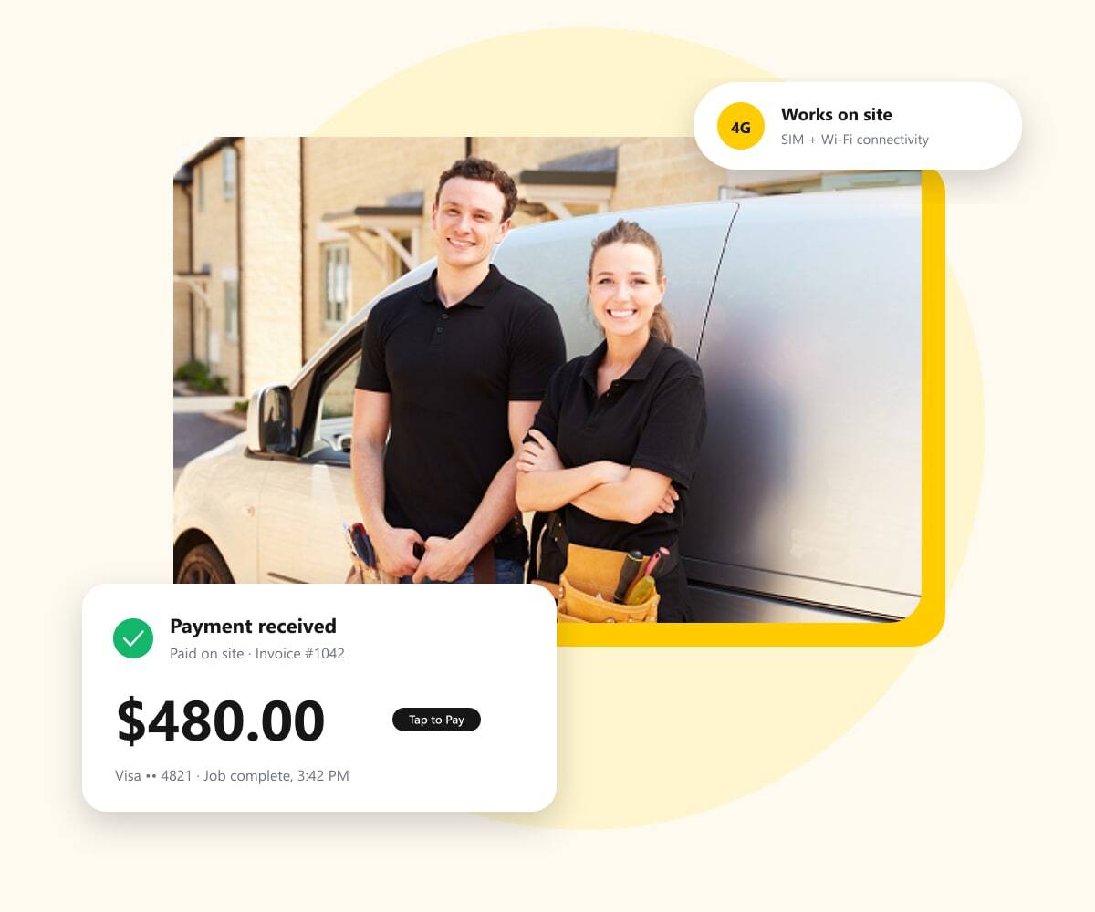Two tradespeople beside their work van, with a payment received on site notification